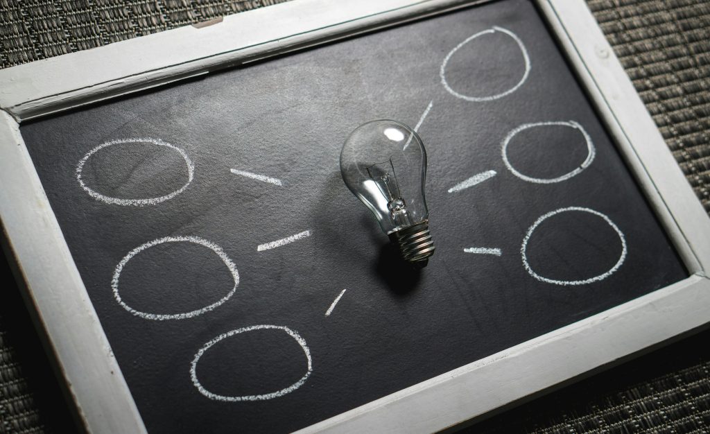 pexels-photo-356043-356043 Chalkboard with a light bulb symbolizing ideas and creativity. Perfect for education themes.